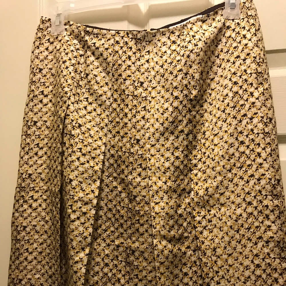 Pleat Front A lone knee length skirt